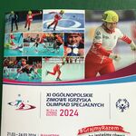 Plakat  z napisem - XI Ogólnopolskie Zimowe Igrzyska Olimpiad Specjalnych.